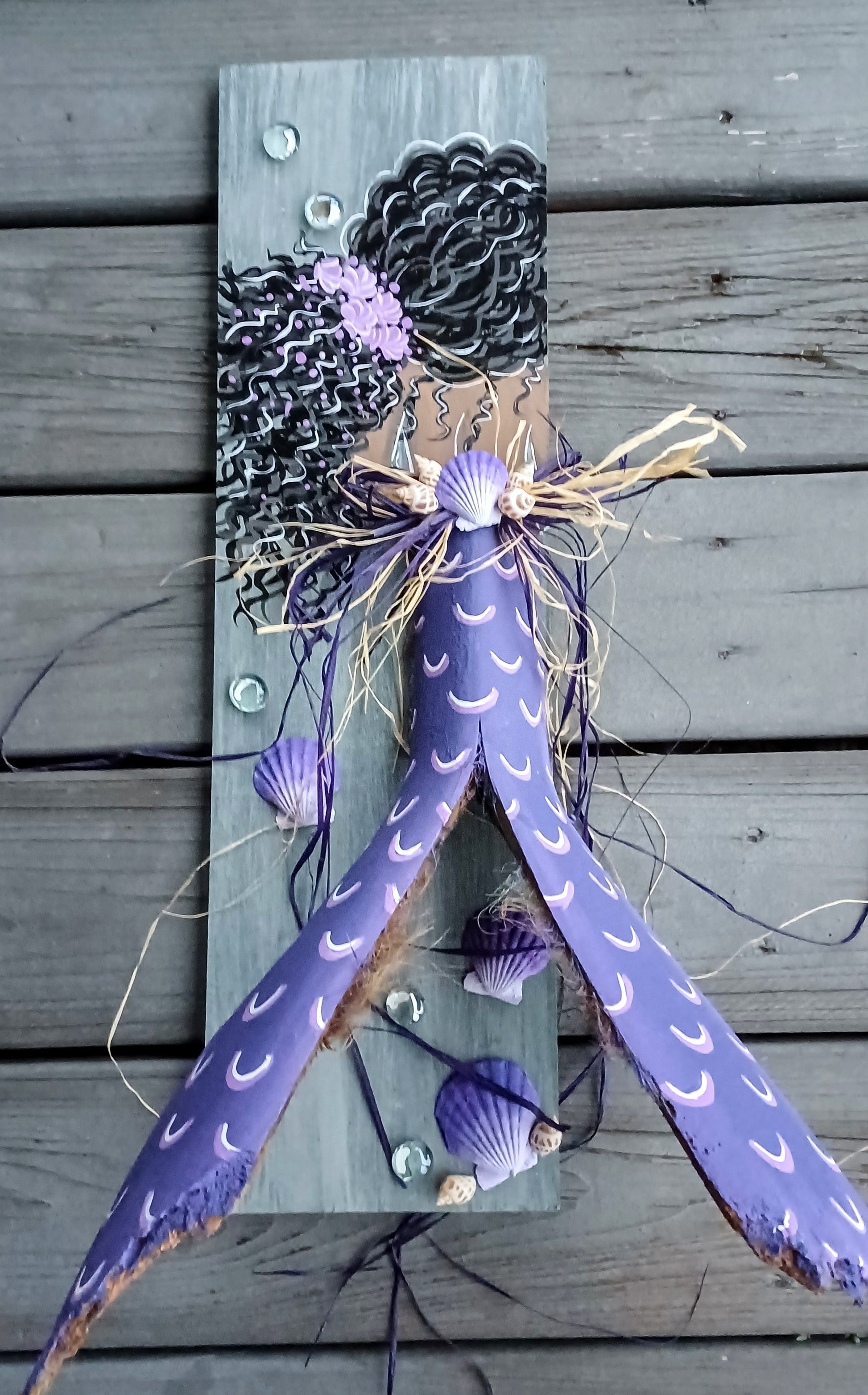 Black mermaid painting with purple palm frond tail on recycled wood 