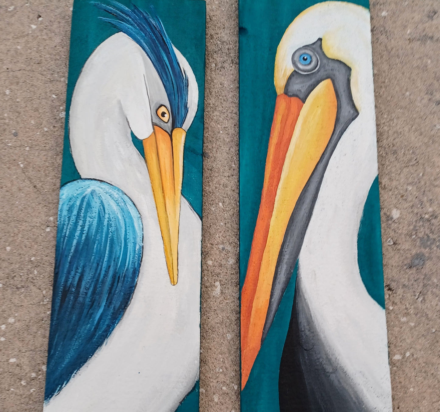 Pelican and blue heron painting on teal reclaimed wood boards