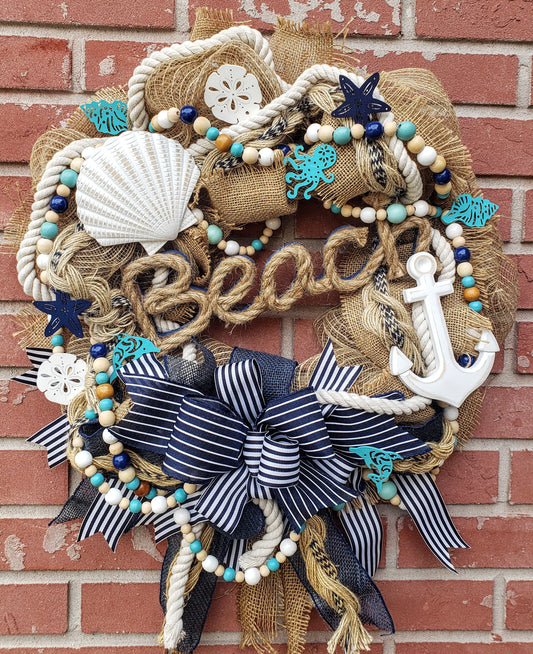 Beach Life wreath with an anchor, starfish and sand dollars. Navy blue, aqua and burlap