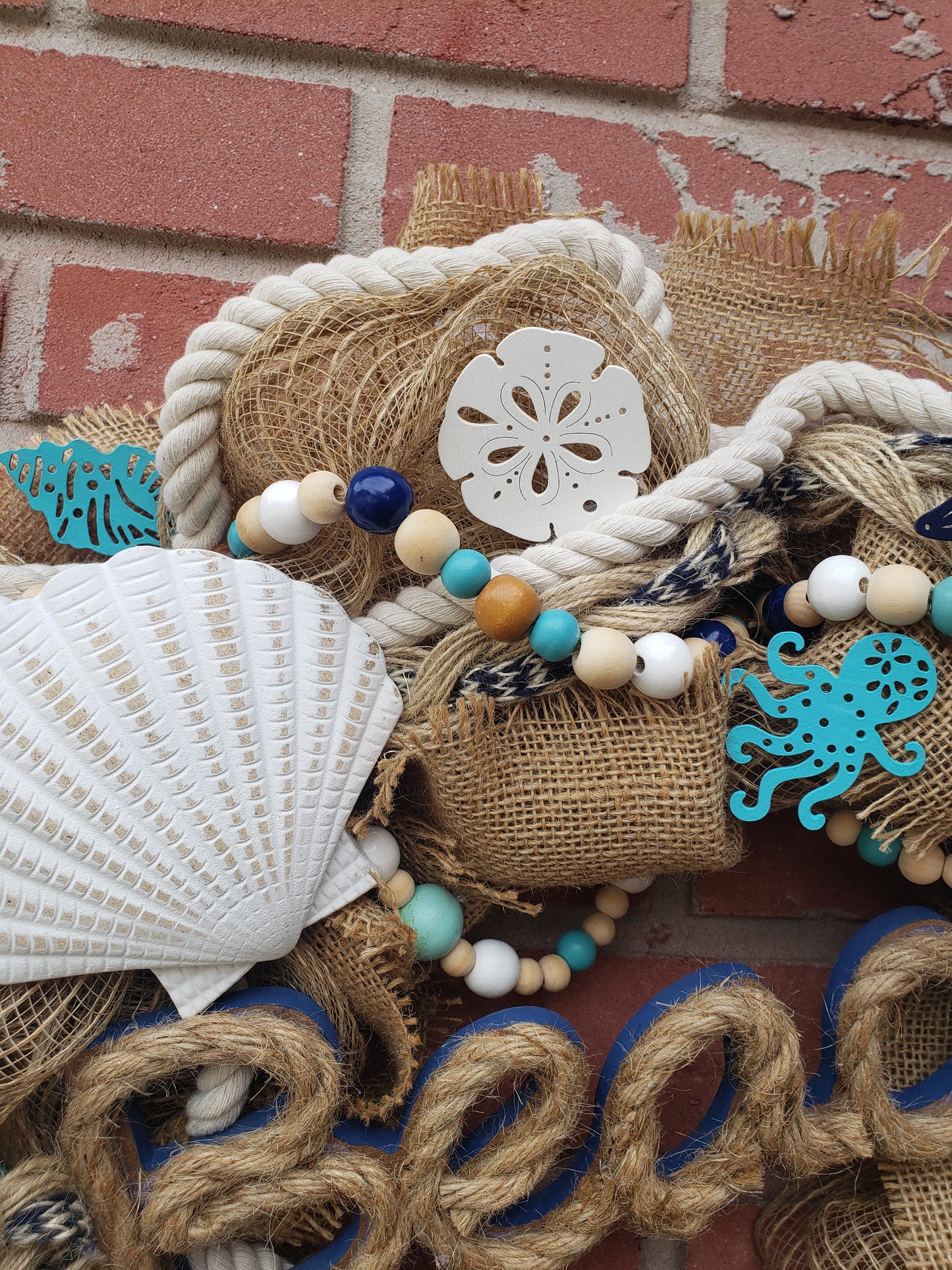 Beach Life wreath with an anchor, starfish and sand dollars. Navy blue, aqua and burlap