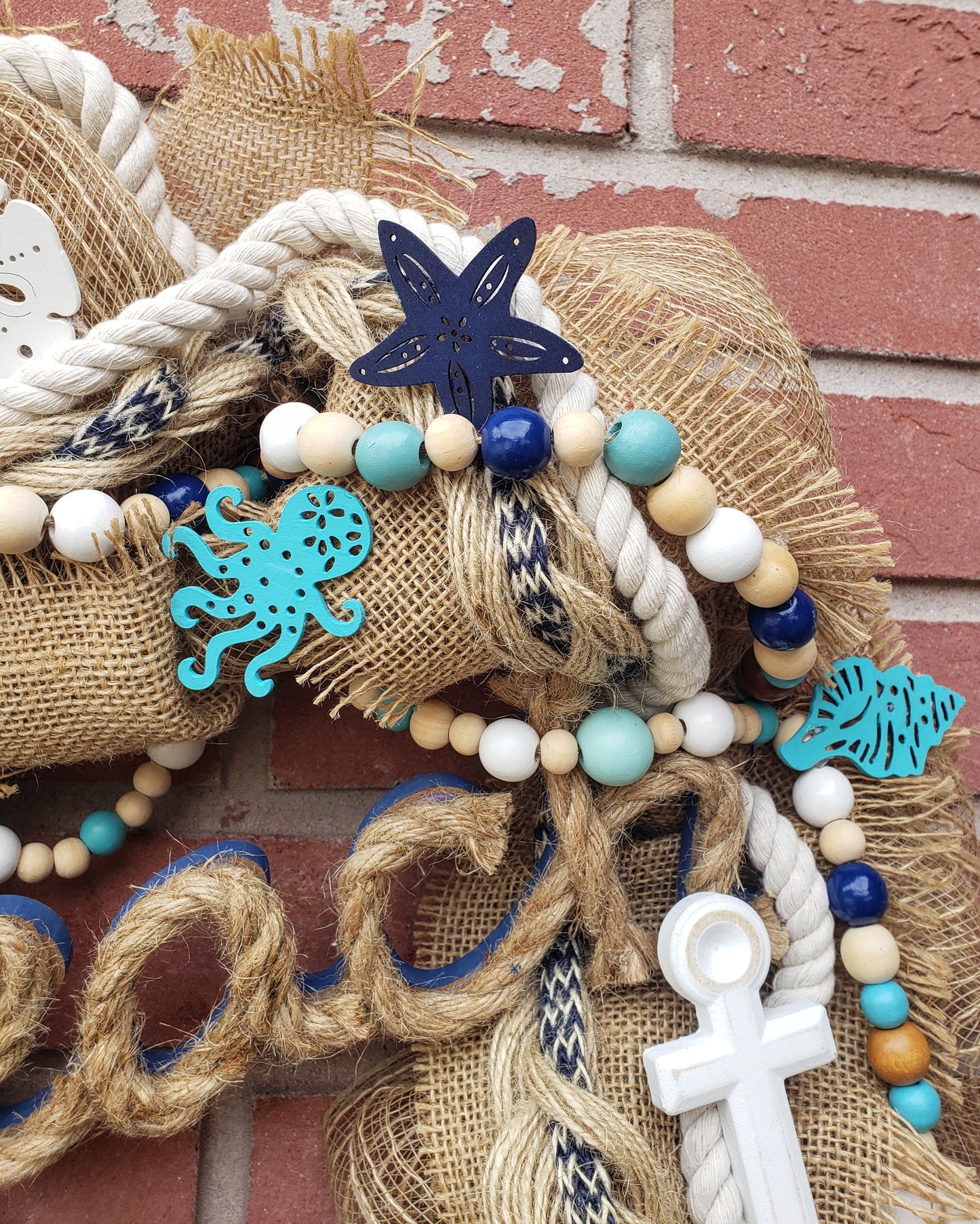 Beach Life wreath with an anchor, starfish and sand dollars. Navy blue, aqua and burlap