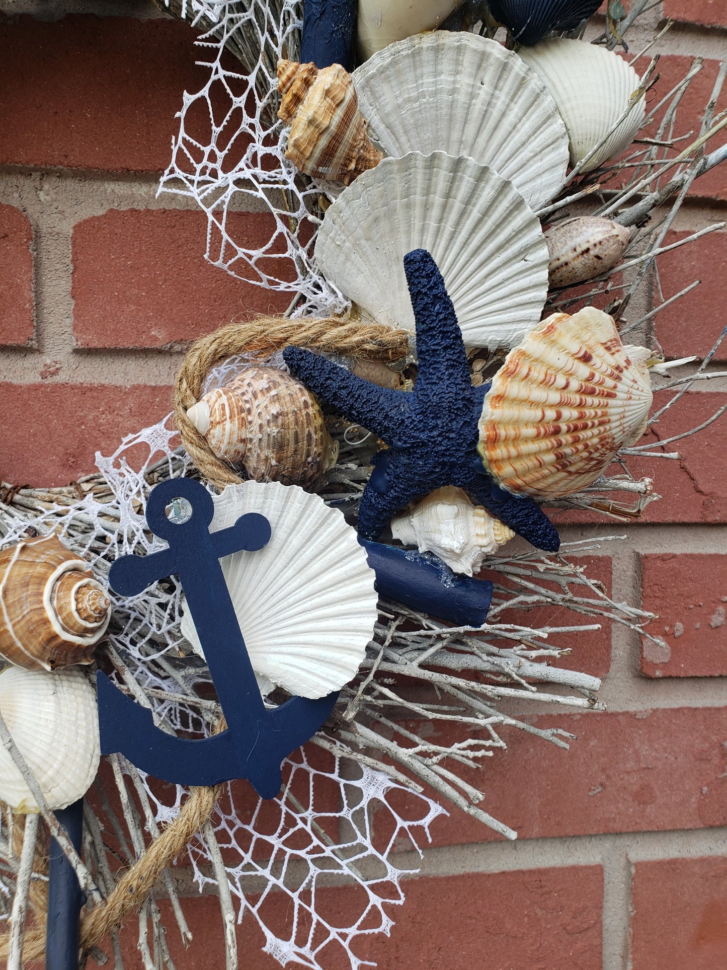 Beach themed wreath shells, statfish, nautical rope and more