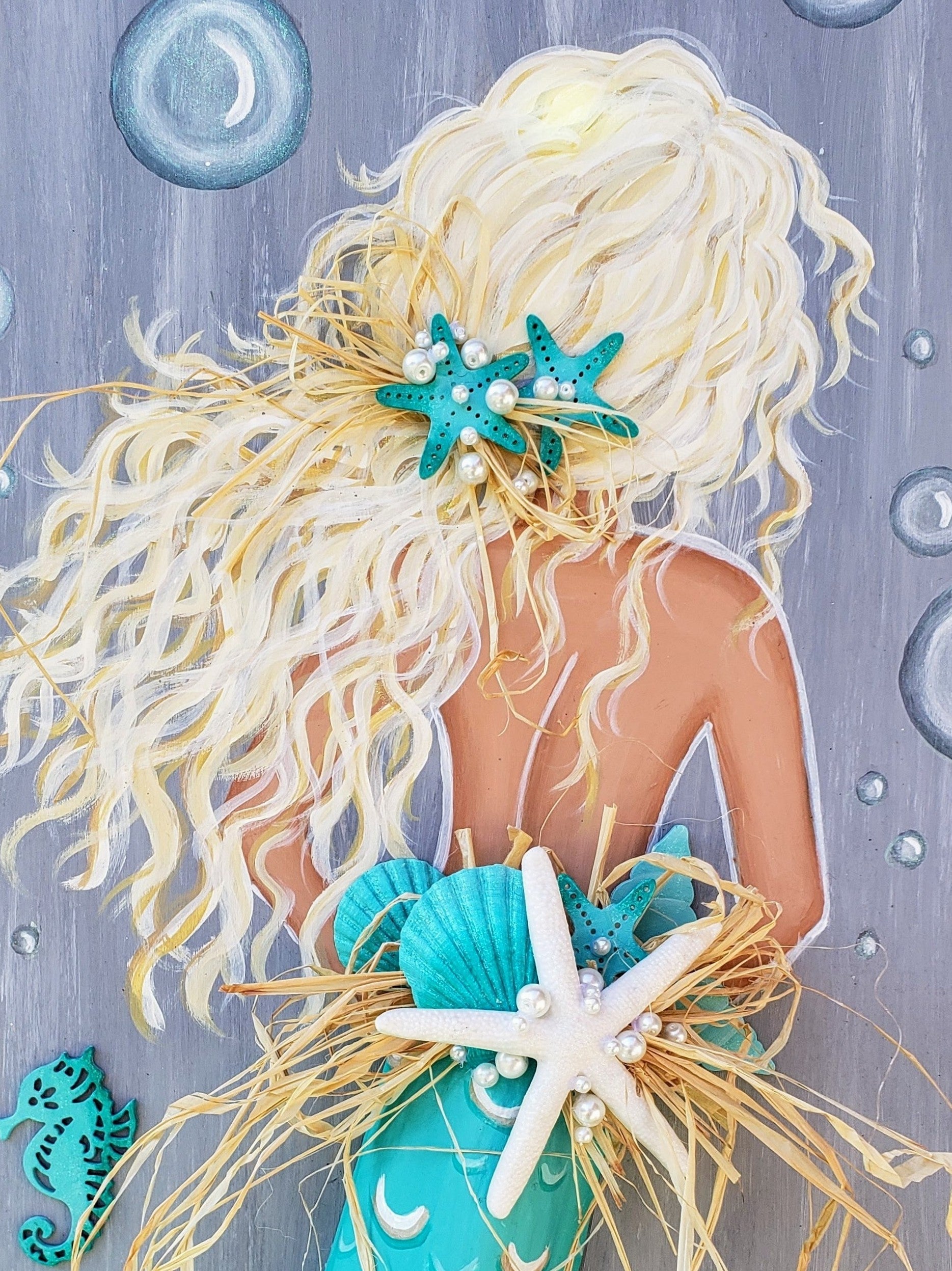 Aqua mermaid painting with palm frond tail on recycled wood 