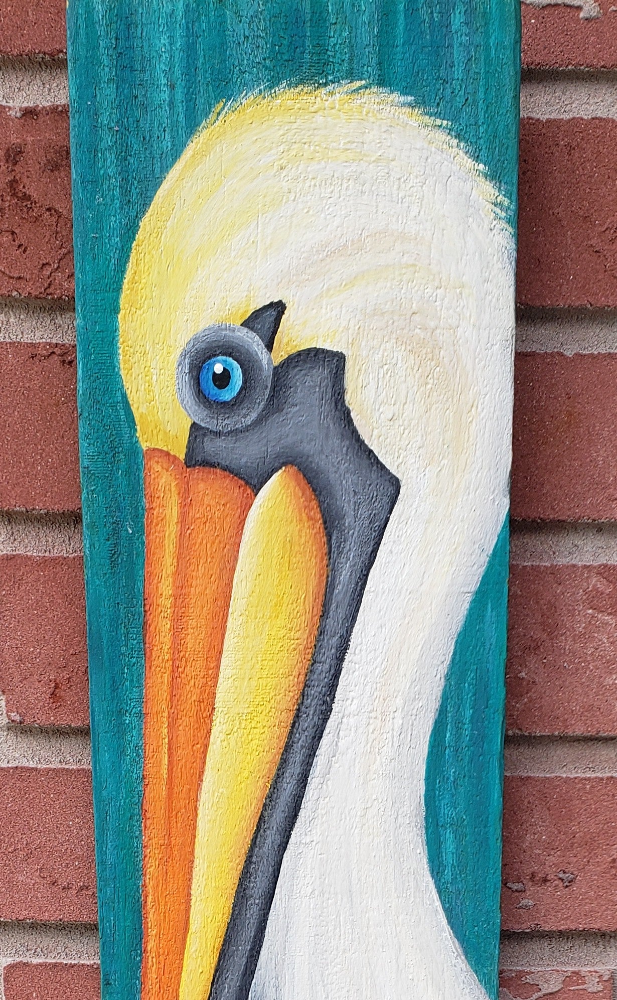 Pelican painting on a teal wood board 22x6