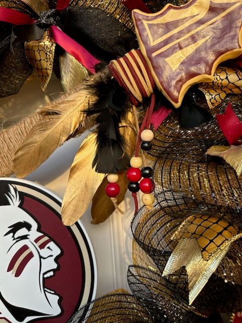 Noles wreath with leather and jute wrapped clay spear