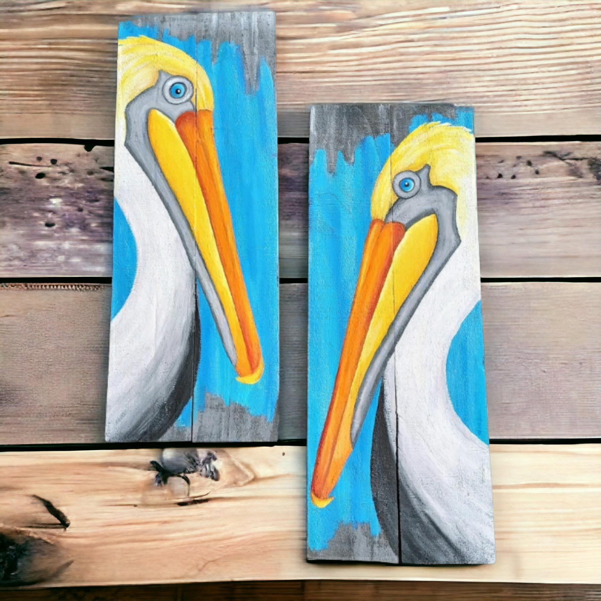 Pelicans painted on recycled wood boards with a turquoise blue accent color